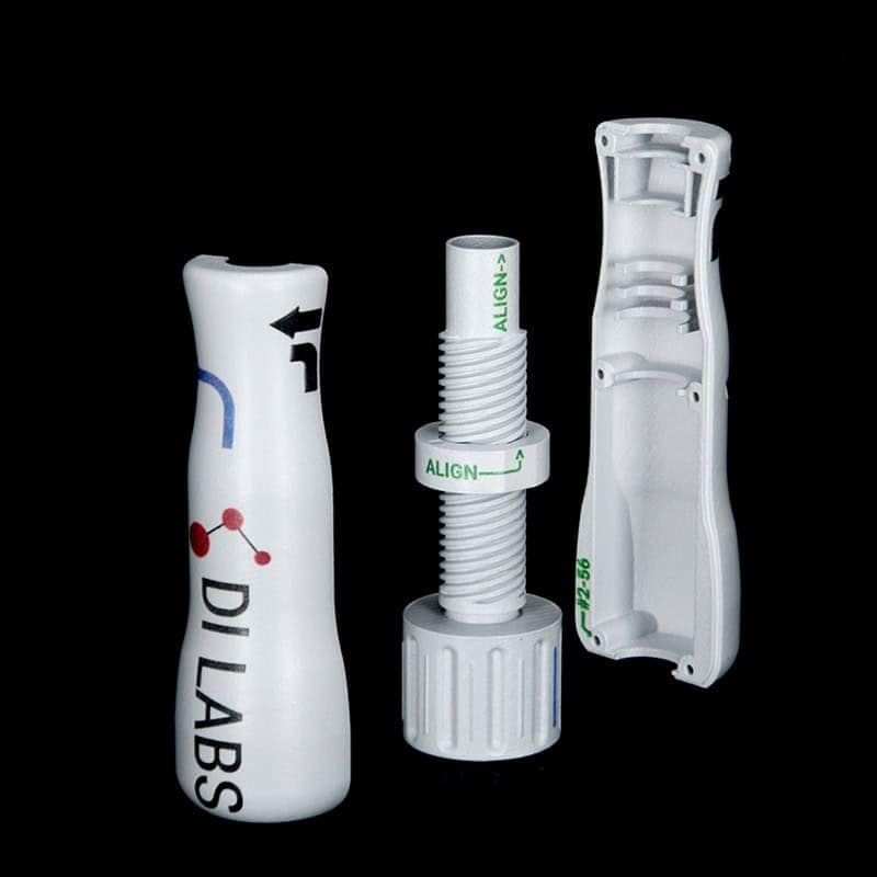 White catheter handle production components with printed markings, manufactured by DI Labs